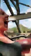 scared woman on roller coaster