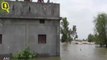 A crocodile lands on roof of a house in flood-affected Raybag taluk in Belgaum.