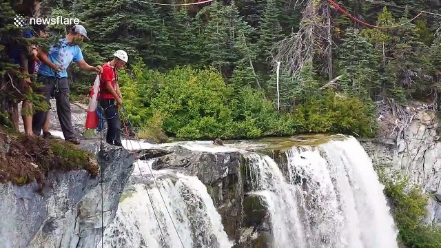 German daredevil rope swings off 850ft waterfall in Canada