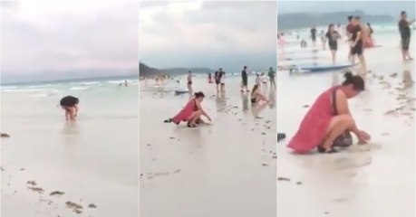 Turista é filmada a enterrar fralda suja em praia paradisíaca