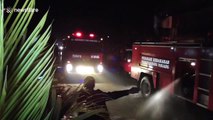 Shocking moment broken elevator triggers explosion at Indonesian warehouse and badly burns employee