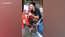 Heartwarming moment tourist gives brand new wheelchair to disabled man begging outside shops