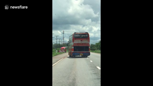 Broken bus drives diagonally on Thai motorway