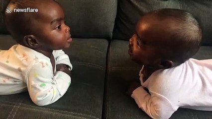 Adorable babies discover they are identical twins