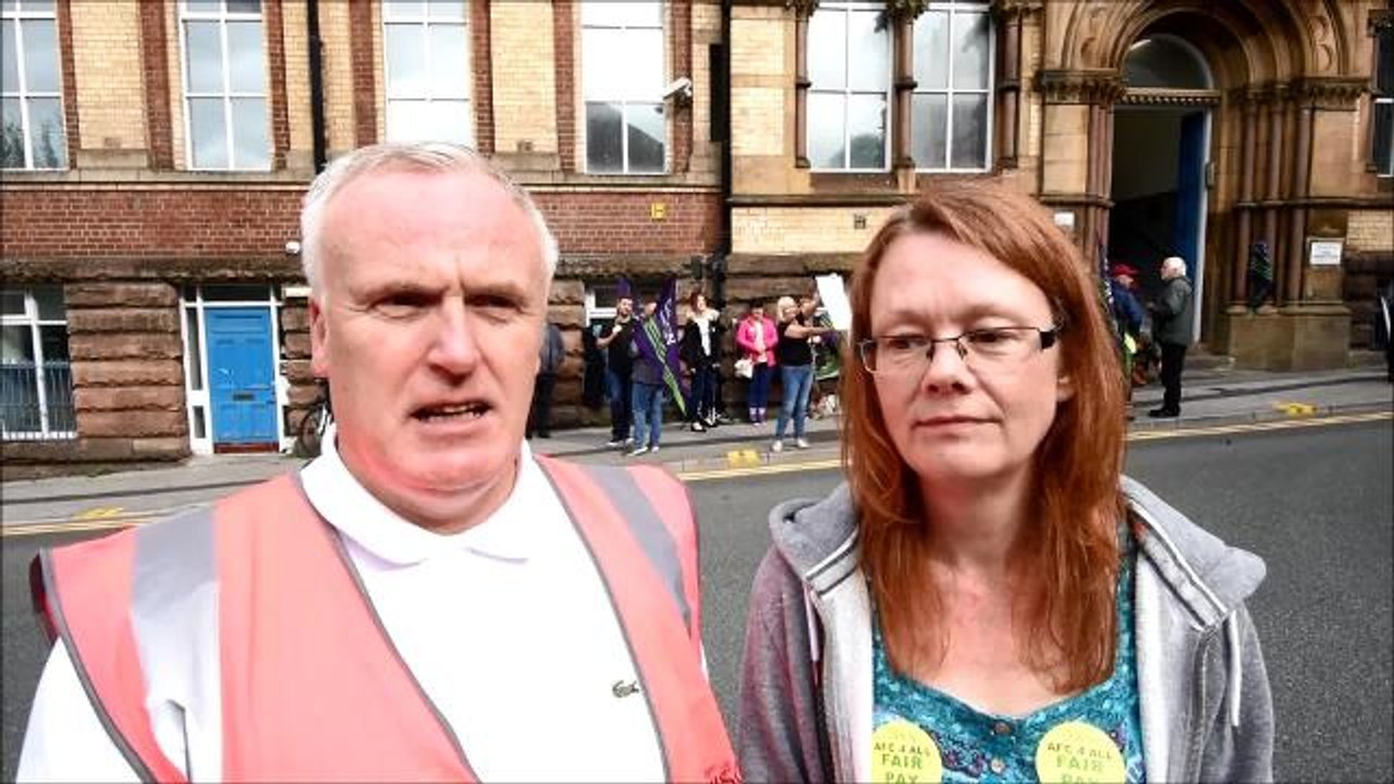 Union representatives speak on the picket line