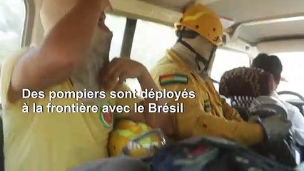 Des pompiers boliviens surveillent la région touchée par les incendies