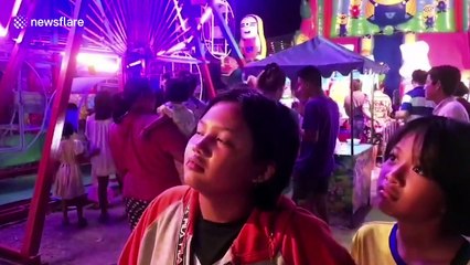 Thai tourists get trapped on fairground ride for two hours after fuse box blew