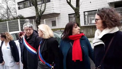 Hospital staff form human chain around Paris hospital to protest "underfunding"