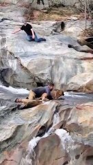 Man Rescues His Dog from Frigid Waterfall