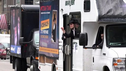 Orthodox Jews watch 70 'mitzvah tanks' roll through NYC to celebrate rabbi