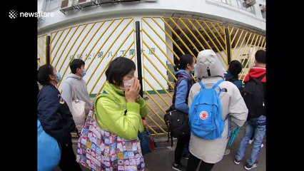 Hongkongers camp overnight and queue around the block in race to buy face masks