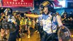 Police spokeswoman responds to officer firing a warning shot during clash with anti-government protesters, saying action was ‘valiant’ and ‘restrained’