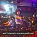 Hong Kong police say violent protesters forced use of water cannon, warning shot