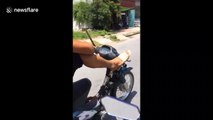 Man steers motorbike with legs while driving high-speed on Vietnam road