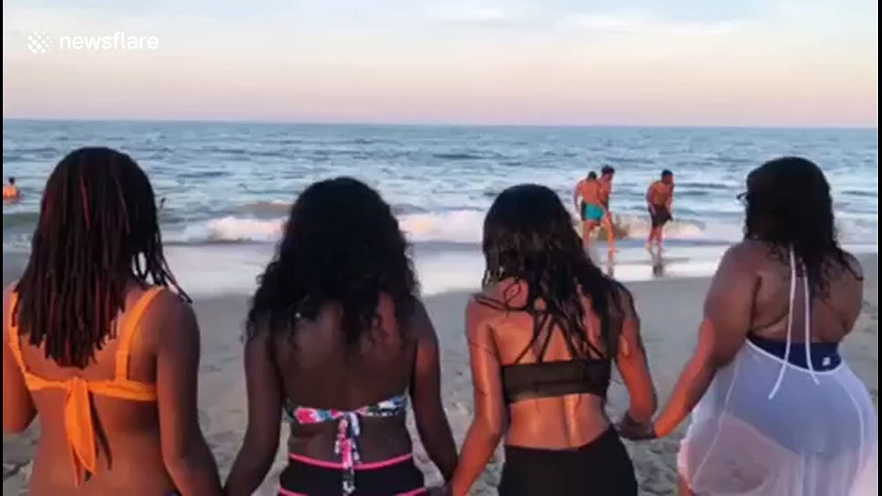 Hilarious fail when Virginia women attempt cinematic run into ocean but one ends up face-first in sand