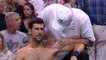 Djokovic shrugs off shoulder injury to advance