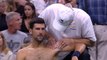 Djokovic shrugs off shoulder injury to advance