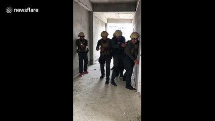 Hilarious moment bungling cop accidentally bounces grenade off wall