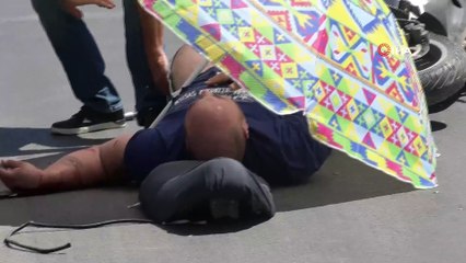 Antalya'da 40 derece sıcaklıkta yaralıya plaj şemsiyeli koruma