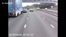 Dashcam catches near miss as UK car pulls out in front of speeding truck