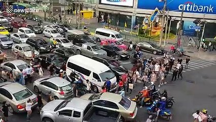 Cars cover zebra crossing during rush hour traffic in Bangkok