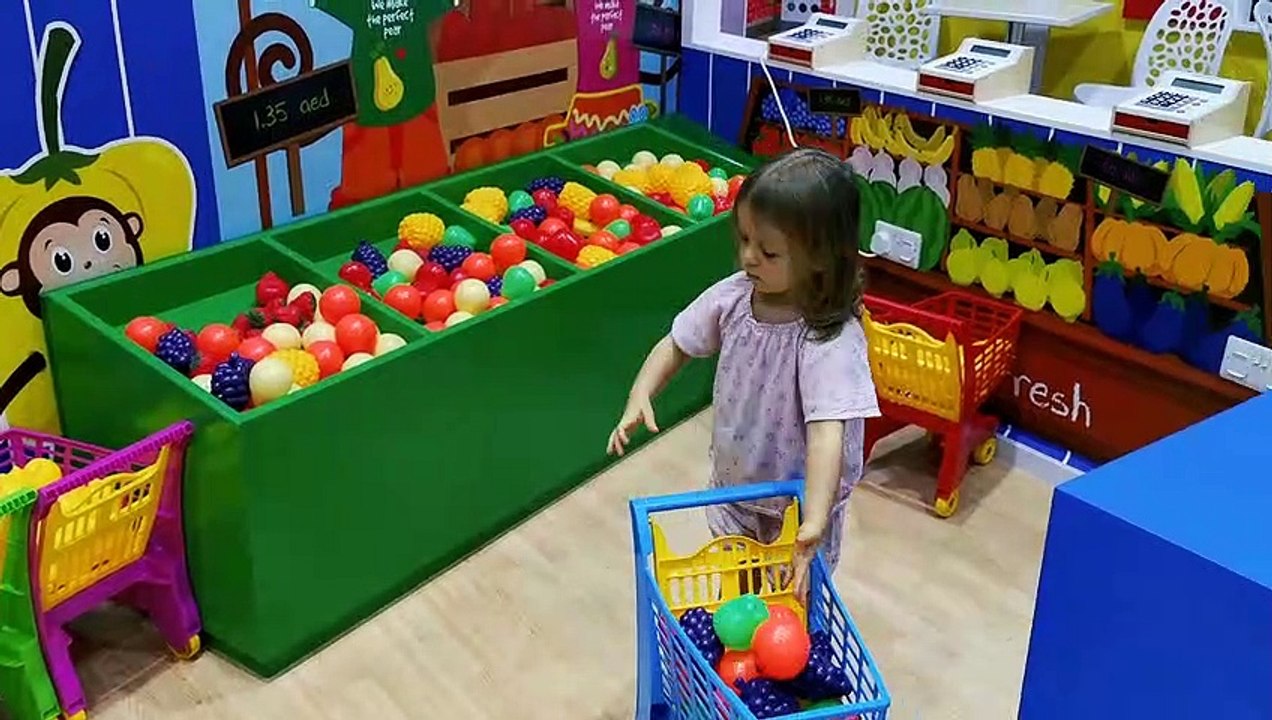 Little Mia playing kitchen in indoor playing area Cheeky Monkey Dubai. Kids entertainment