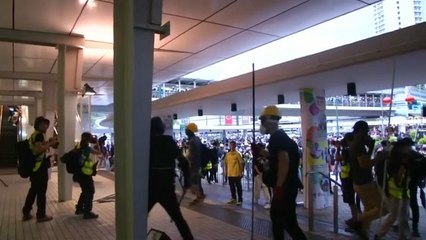 Download Video: Hong Kong protesters target transit station as riot police mount search