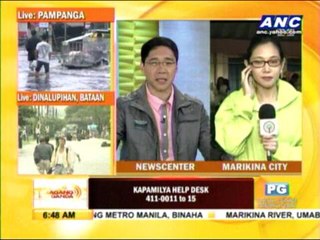 Evacuees crowd inside Marikina school