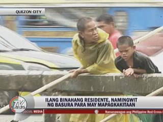 QC residents sift through flood for sellable junk