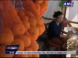 Tacloban orphan survives by selling candies, cigarettes