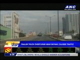 Trailer truck overturns near Skyway, causes traffic