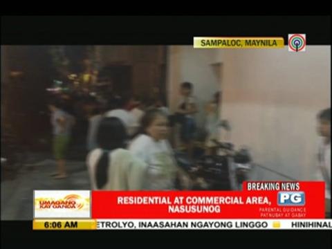 Fire razes building, homes in Manila
