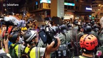 Young woman forcefully detained after intense skirmish outside Hong Kong police station