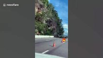 Thai driver captures the moment landslide smashes into road