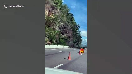 Thai driver captures the moment landslide smashes into road