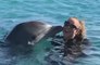 Mariah Carey swims with dolphins