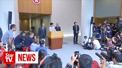 Hong Kong leader says China backs her "all the way"