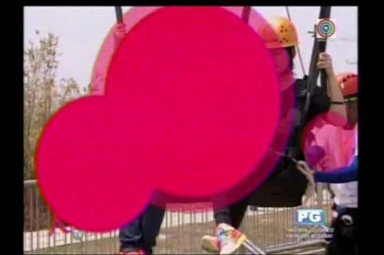 Kris, Shaina ride giant swing at Sandbox