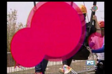 Kris, Shaina ride giant swing at Sandbox