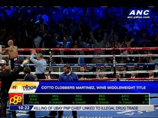 Cotto clobbers Martinez, wins middleweight title