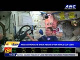 Astronauts shave heads after World Cup loss