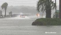 Floodwaters almost sweep driver away
