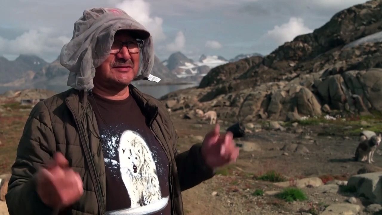 In Greenland village, shorter winters cast doubts over dog sledding