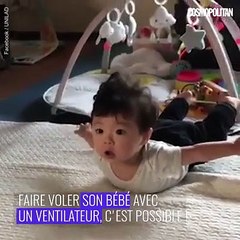 Un bébé qui vole avec un ventilateur