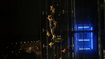 Polish speed climber beats lift in neon night race