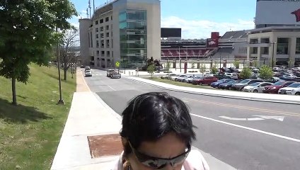 BDMV-61 Aruna & Hari Sharma walking at Univ Arlansas Fayeteville Cmapus Bookstore May 13, 2019