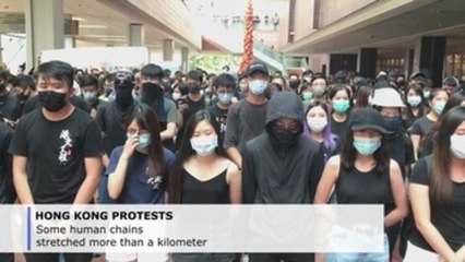 Honk Kong students form human chain to mark protest milestone