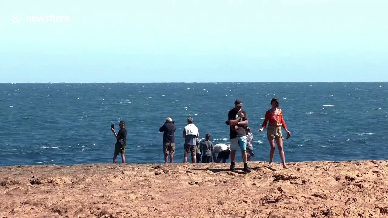 Nervy moment hapless tourists in Australia get perilously close to dangerous water spouts