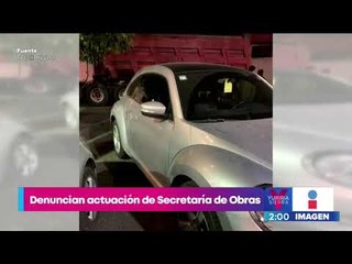 Trabajadores mueven vehículos con palas para repavimentar calles de la CDMX | Yuriria Sierra