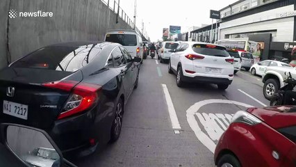 Hero couple on motorbike save kitten inches from being crushed by car wheel in Manila